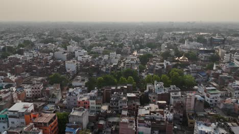 high-angle view of varanasi's riverfront, where the ganges flows past ancient stone steps, vibrant temples, and the ever-busy lanes of the old city.