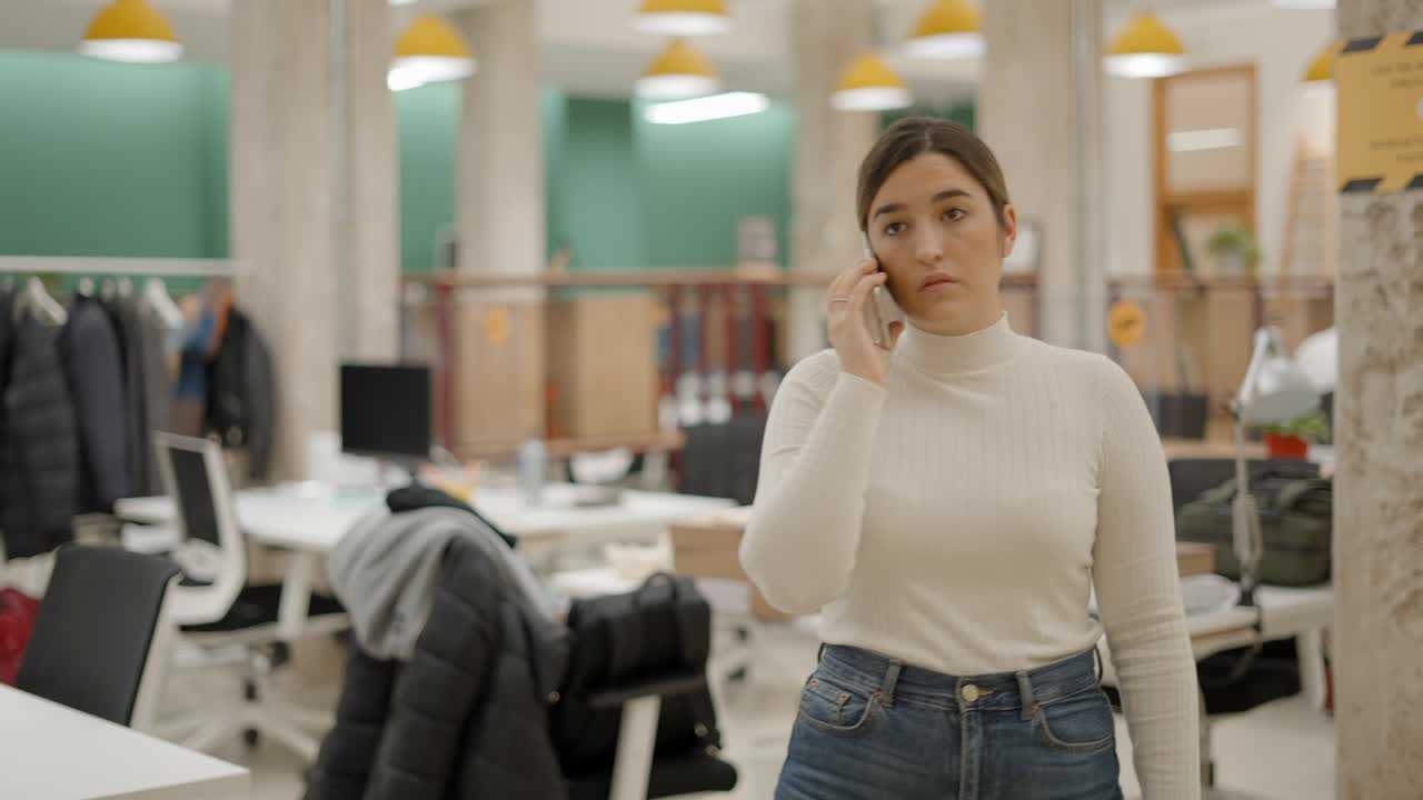 Woman on Phone in Modern Office