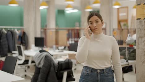 woman on phone in modern office