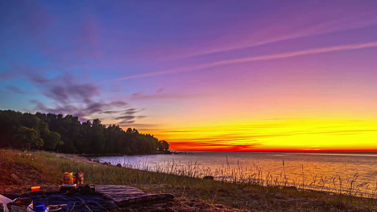 Stunning Sunset at the Beach with Camping Scene
