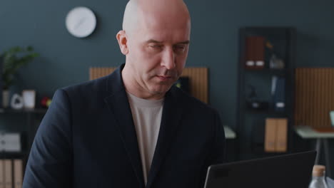 business man working on laptop in office