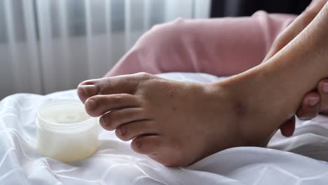 applying foot cream