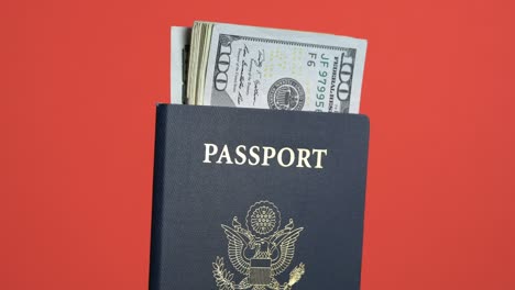 usa passports with a pile of dollar bills for travel concept