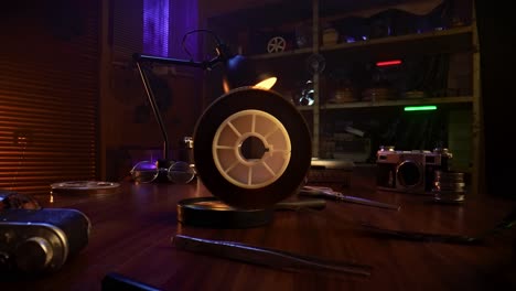 vintage film reel and equipment in a darkroom setting