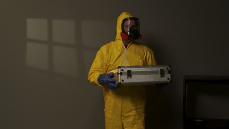 Hazmat-suit-wearing-man-explores-a-smoky-room