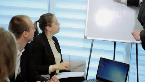 businesspeople sitting at the boardroom and discussing business plan