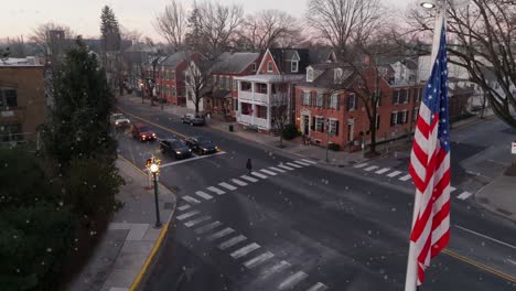 American-flag-in-town-square-during-winter-Christmas-scene