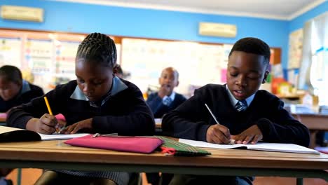 schoolkids studying in the classroom 4k
