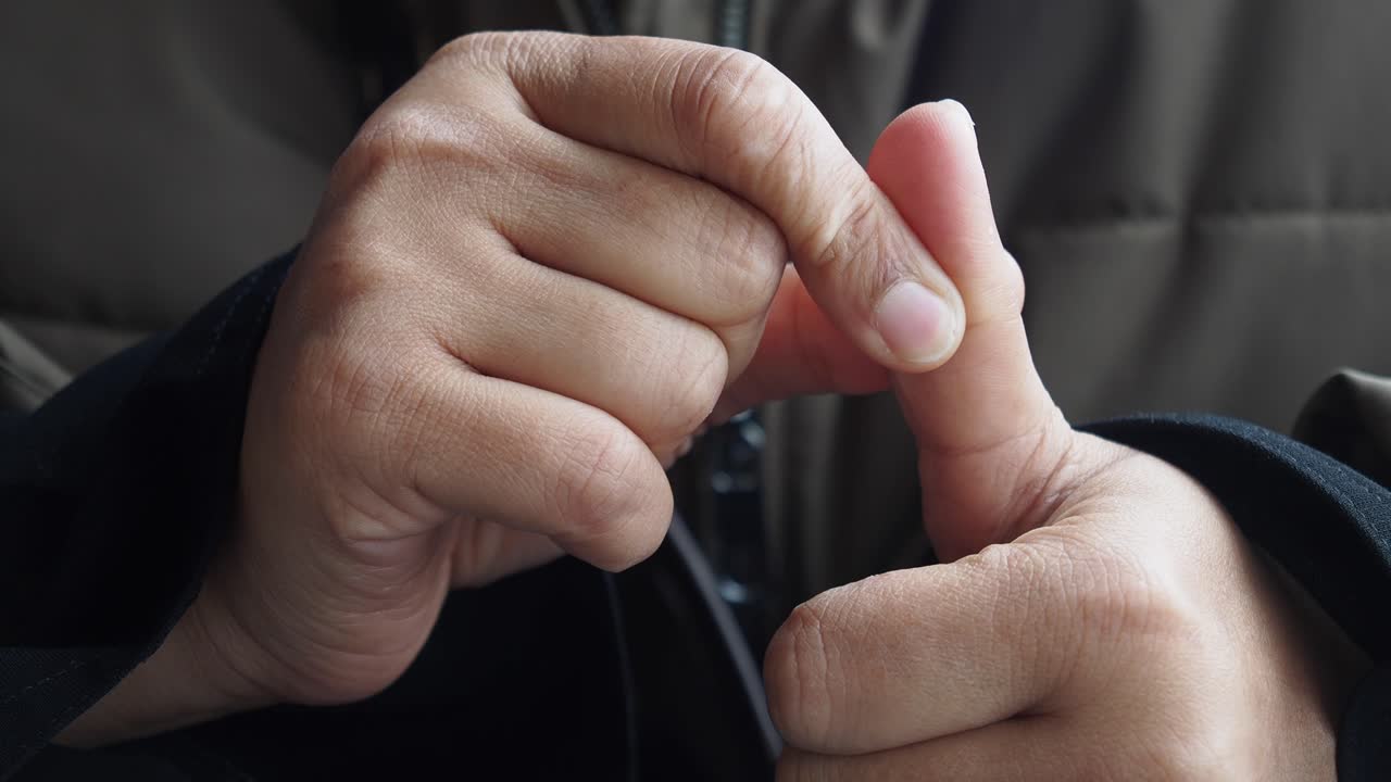 Person with fingers crossed