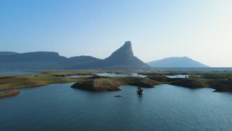 aerial view of karamchat dam during the morning mist, offering a mystical atmosphere around the reservoir.