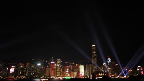 colorful lights illuminate hong kong's skyline at night