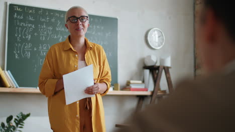 female teacher speaking with student on lesson