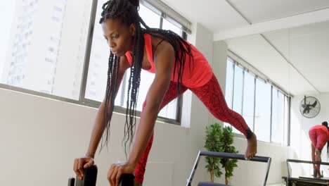 women doing exercise with rowing machine 4k