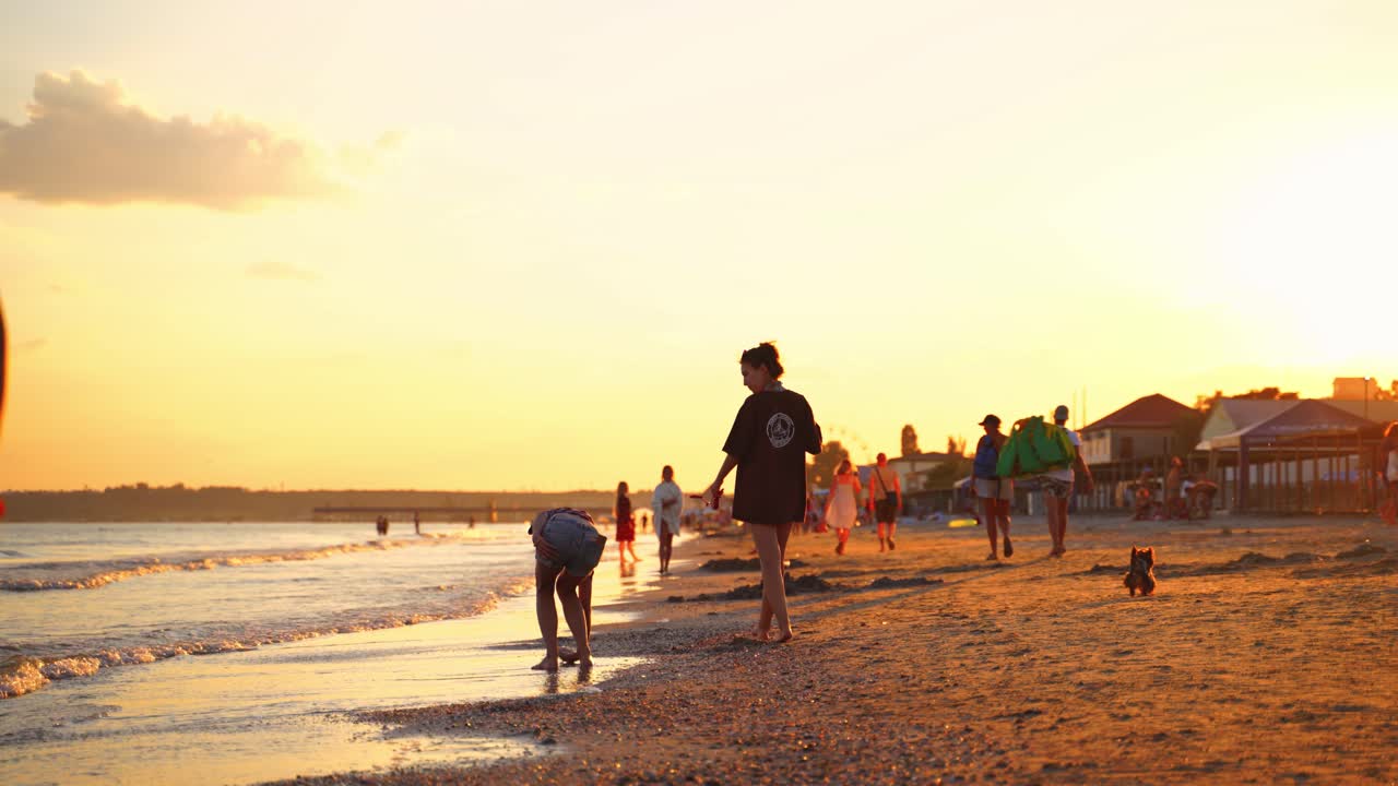 Public beach scenery. View of relaxing people on the beach