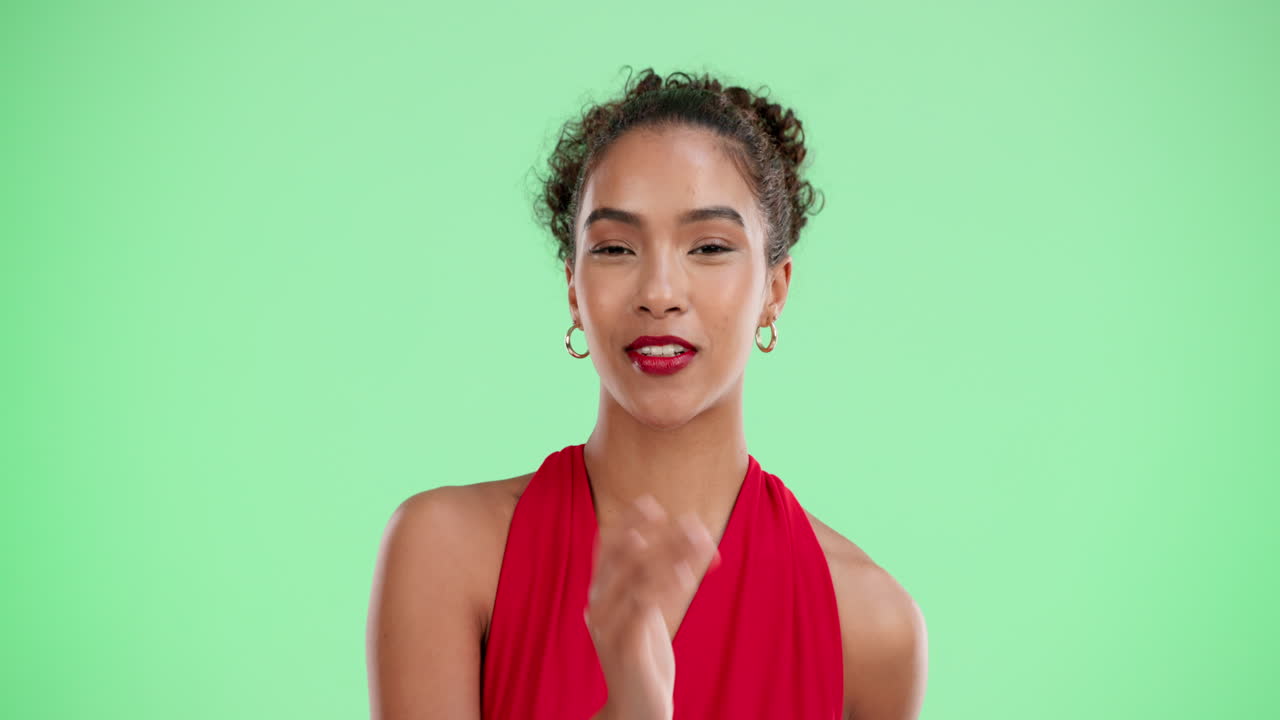 Woman blowing a kiss in a studio shot