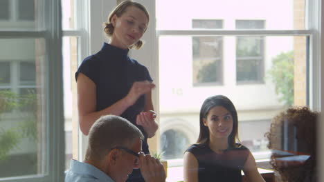 Businesspeople-Meet-In-Boardroom-Through-Glass-Shot-On-R3D