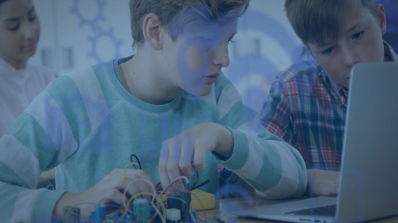 Two boys using laptop and adjusting wiring, tech overlay drifting across desk while testing circuit