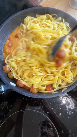 cooking pasta with tomatoes