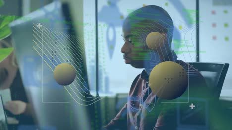 Animation of spheres and digital space over african american man using computer in office