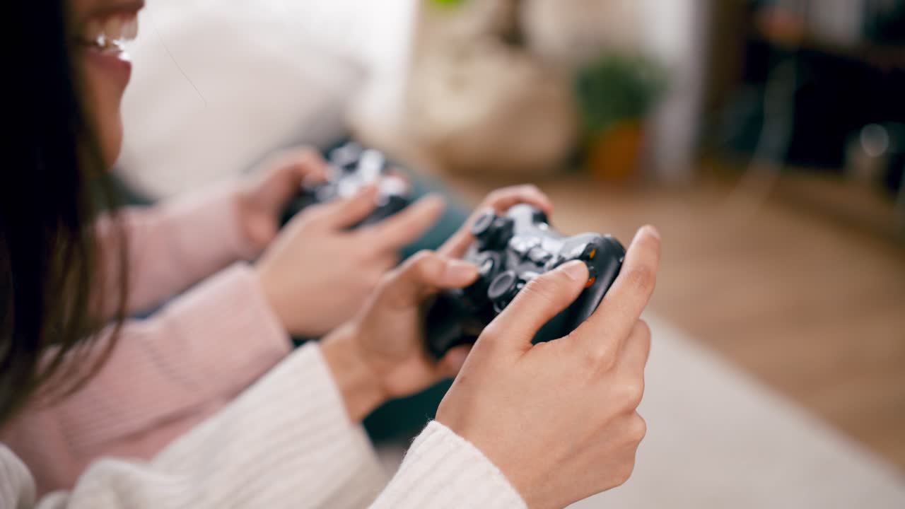 Close-up of Two People's Hands Playing Video Games with Controllers