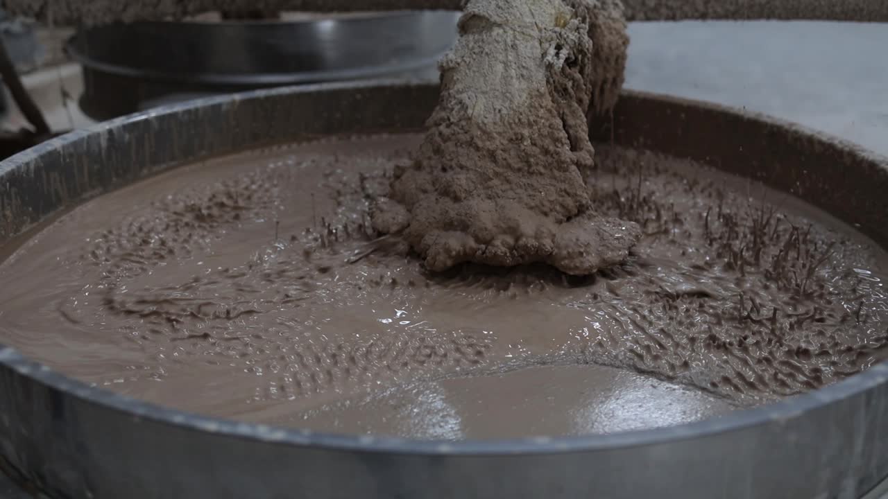 Clay Mixing Process in a Pottery Factory