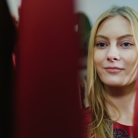 a moldovan woman chooses dresses in a clothing store