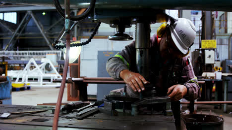 male engineer working on a machine 4k