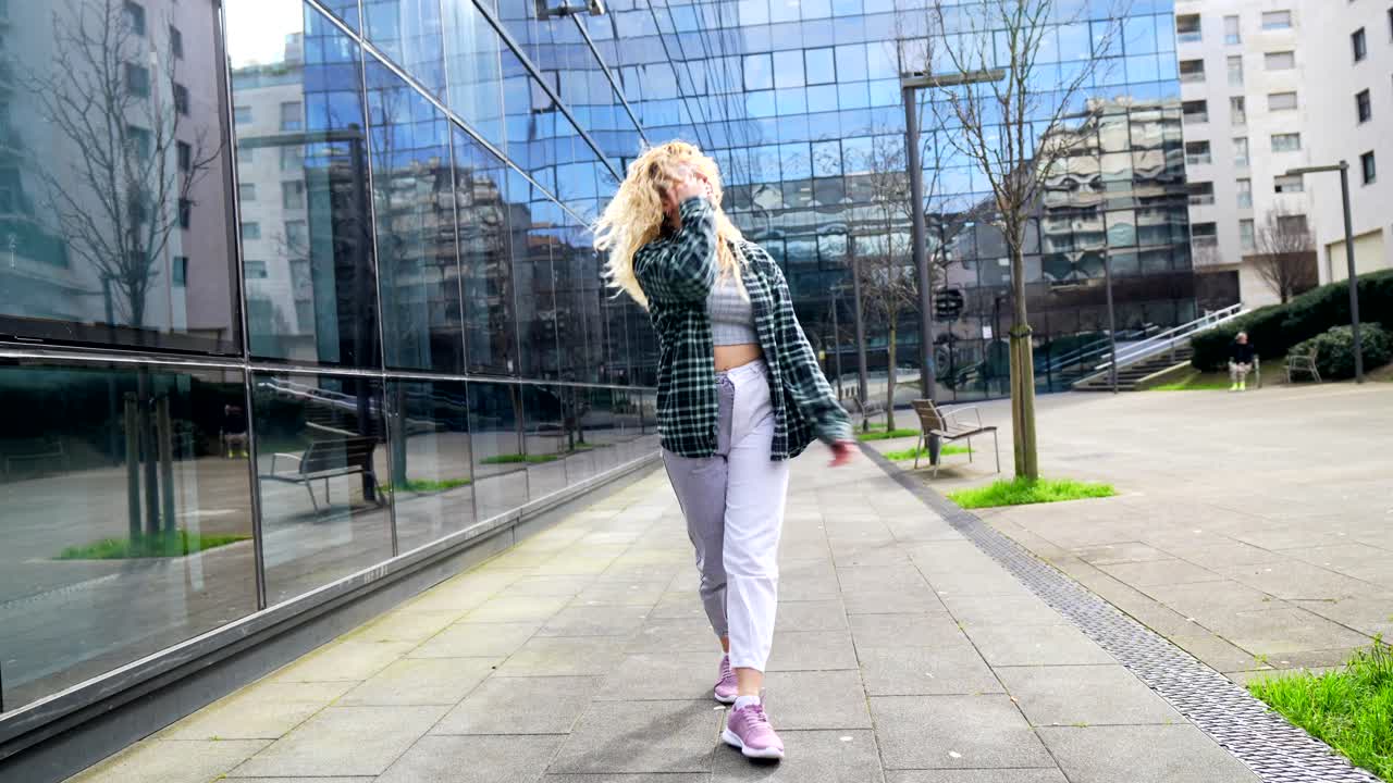 A woman dancing in the city