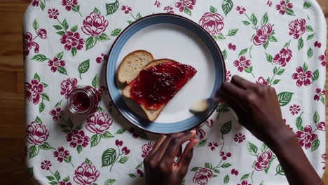 applying jam to toast