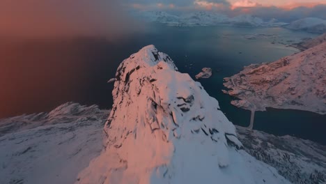 fpv drone dive down a mountain during sunset in lofoten, norway