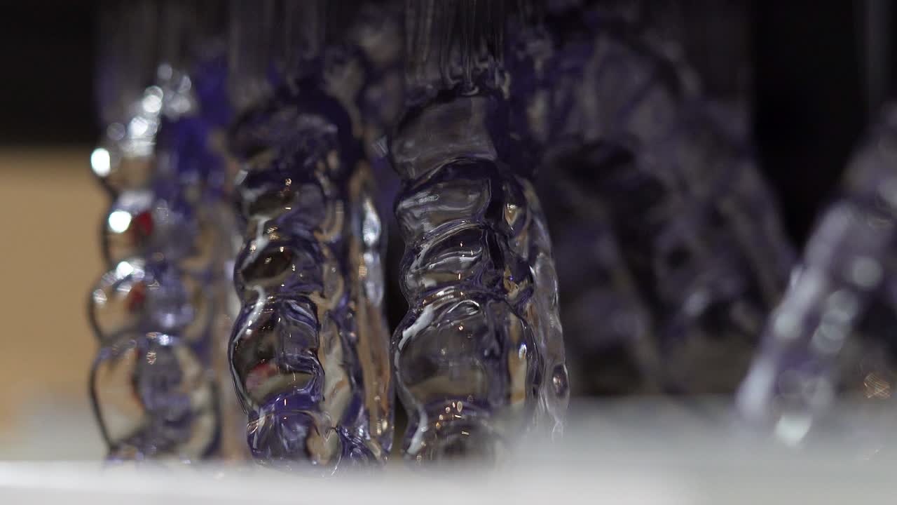 Close-up of freshly 3D printed clear teeth straighteners, Invisalign