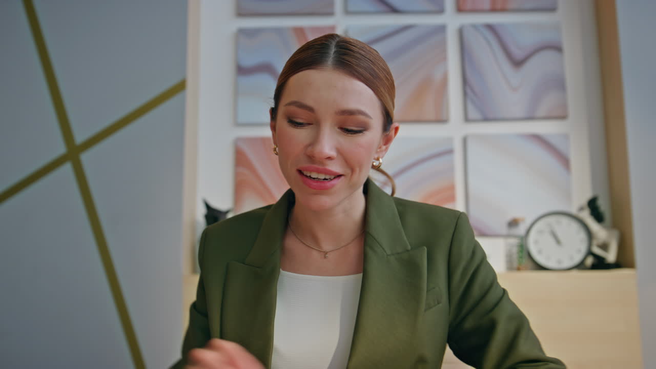 Happy online teacher talking video call office closeup POV view. Smiling woman