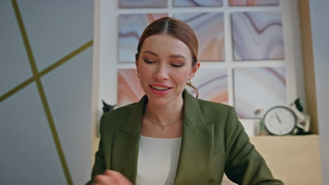 happy online teacher talking video call office closeup pov view. smiling woman