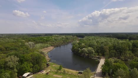 aerial establishing view over small park on bank of tisza river, hungary
