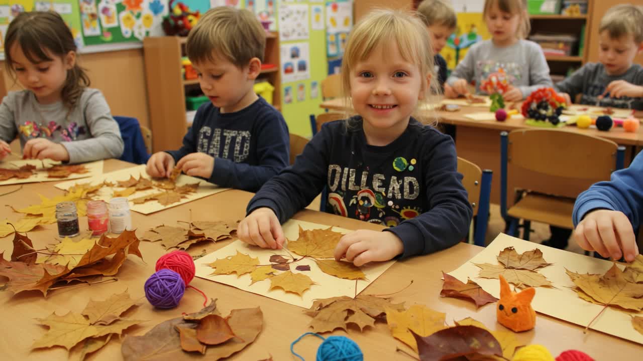 Children making autumn leaf crafts in a classroom