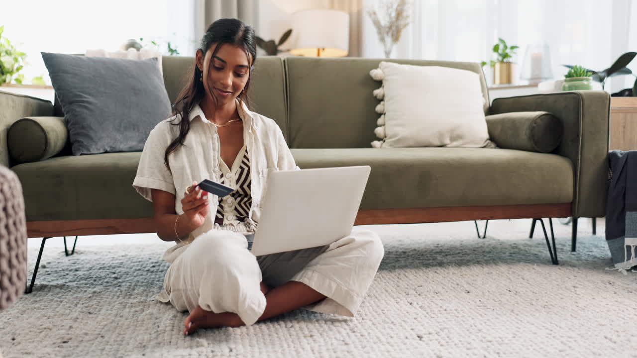 Happy woman, laptop and credit card on floor