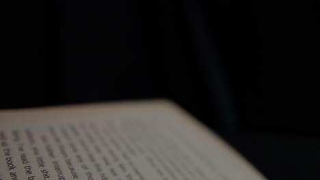 blurred open page of a book slightly out of focus, creating a soft and hazy effect suggesting a dreamlike or abstract state