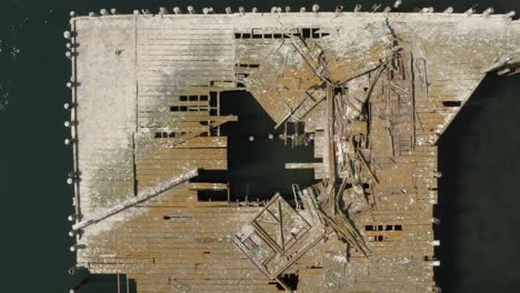 Aerial-video-of-Old-Abandoned-dock-with-birds-flying-past-in-Northern-California-Bodega-Bay