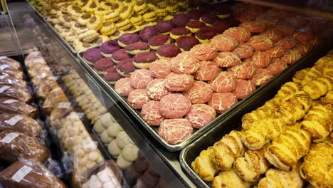 assorted cookies and pastries in a bakery display