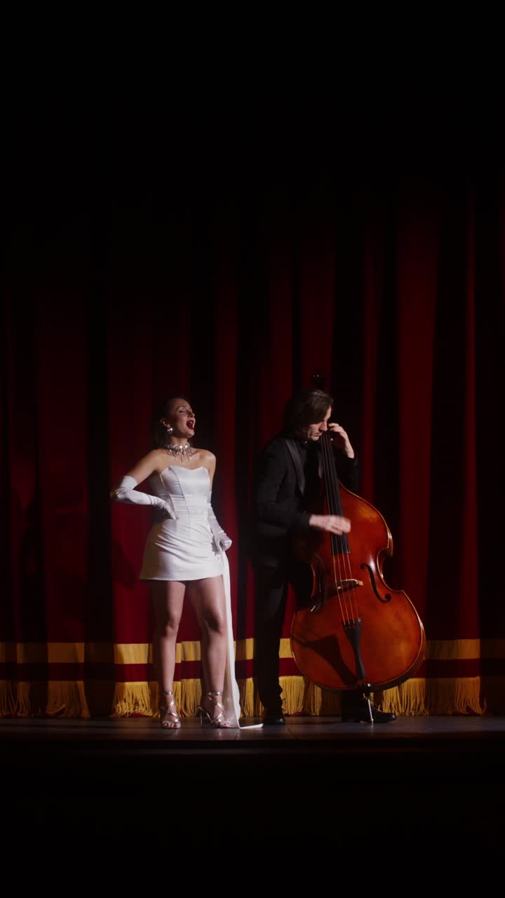 Woman and Man Performing Jazz Music on Stage