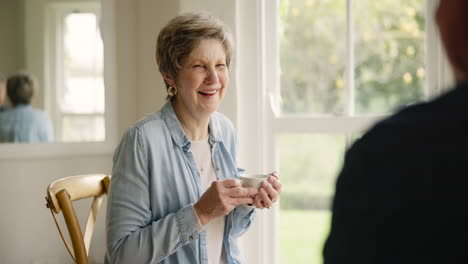 old couple in home, coffee