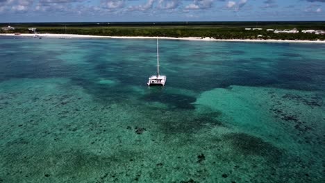 Orbit-Shot-of-a-Catamaran-on-the-Caribbean-Sea-at-Midday