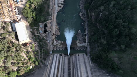 top down aerial shot of dam at very low water level in spain, catalonia, zoom in