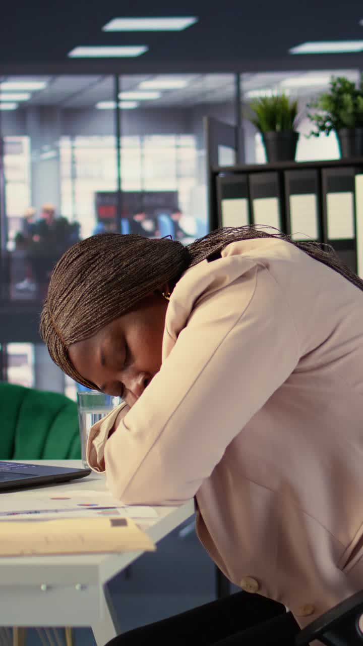Overworked African American Woman Sleeping at Her Office Desk