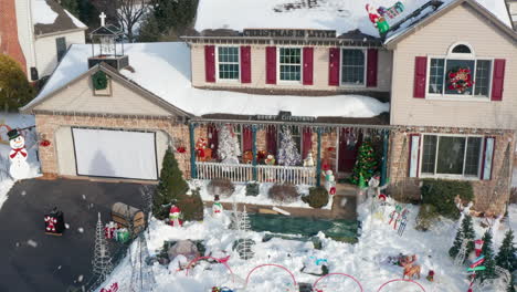 winter snow, front lawn decorated with christmas lights and characters