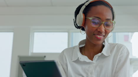 Woman,-tablet-and-music-in-headphones