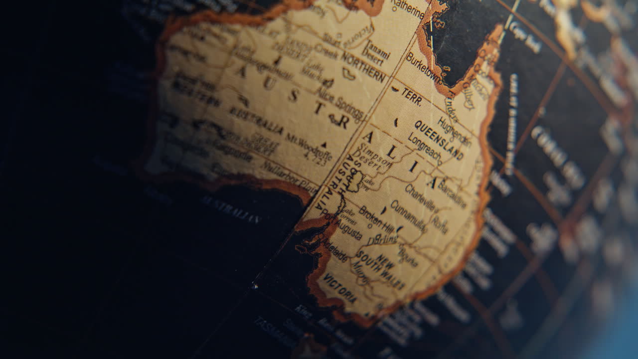 Australia mainland marked globe surrounded black oceans surface closeup