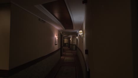 view of round hotel corridor with lighted lamps