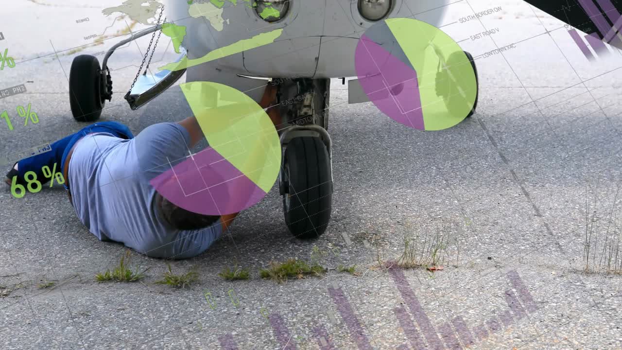 Aviation technician lying under nose gear, inspecting and tightening gear fittings for safe flight