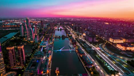 Aerial-Hyperlapse-above-Puerto-Madero,-Buenos-Aires,-Argentina-Modern-Cityscape-Sunset-of-Famous-Urban-Waterfront-and-Central-Business-District